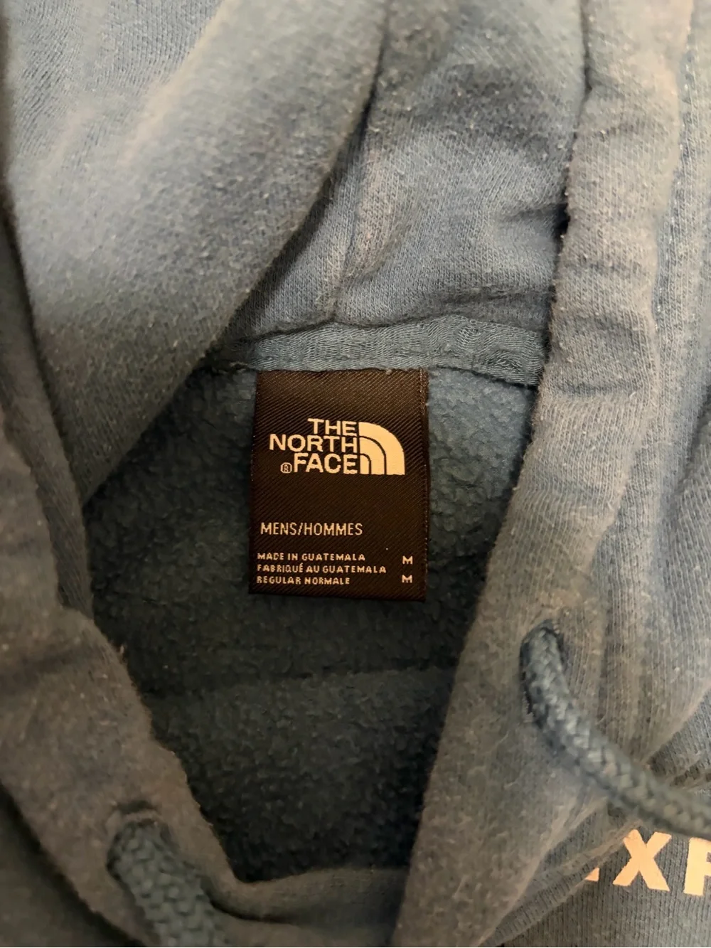 The North Face light blue pullover with black logo patch